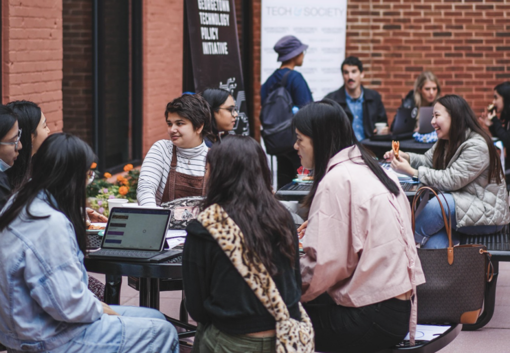 Students working in the Car Barn courtyard.